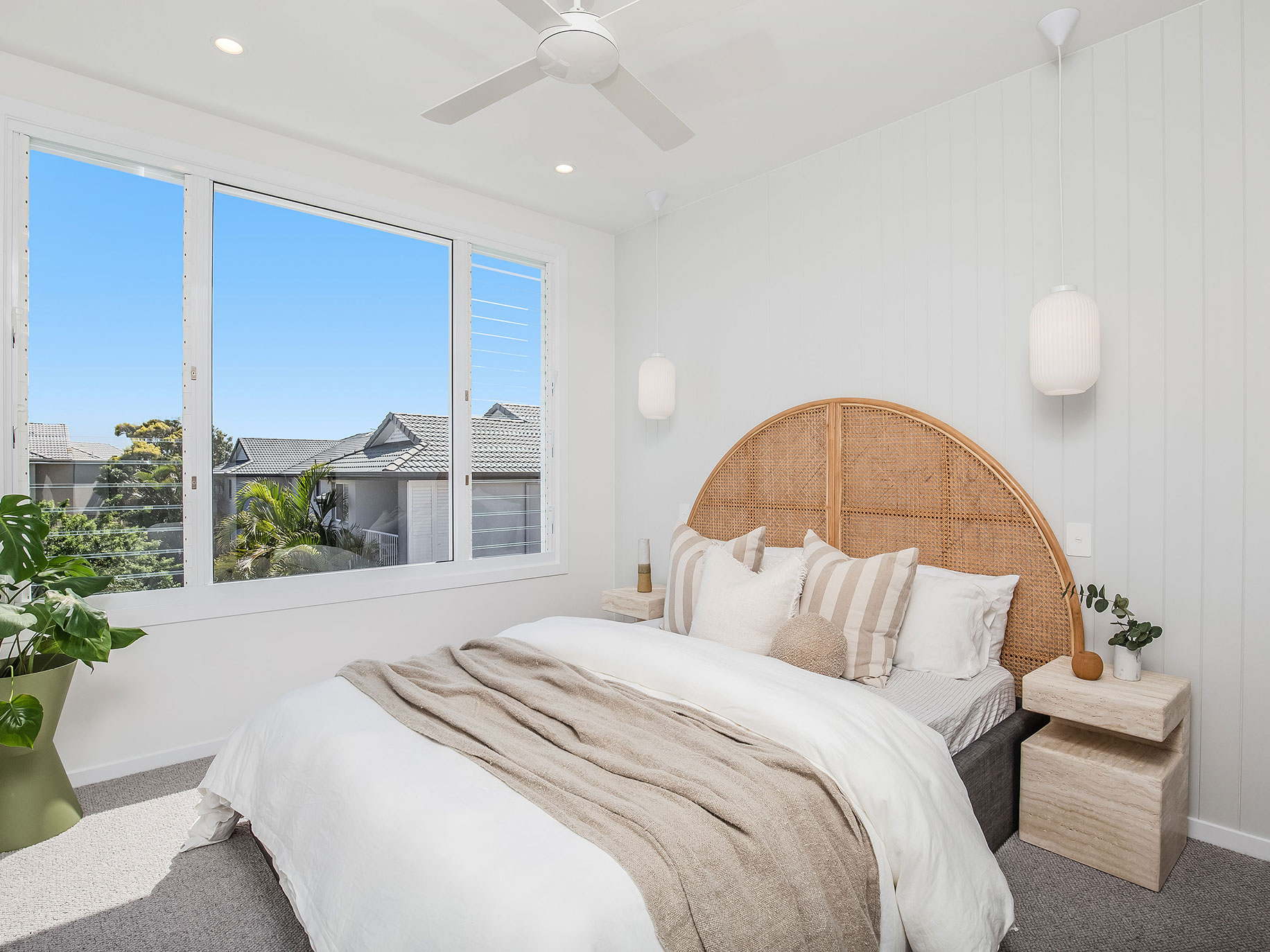 The master bedroom is bright an airy