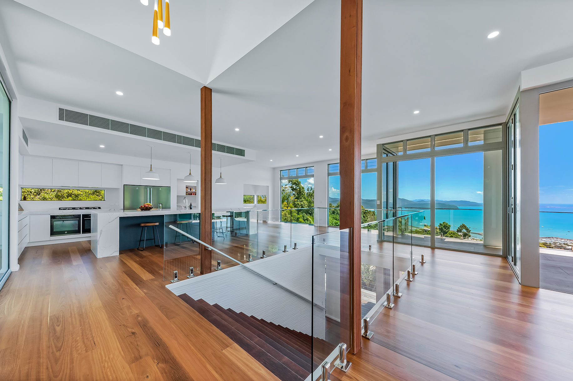 Views to the Coral Sea, and Whitsunday Islands paint glorious natural pictures from floor to ceiling windows.
